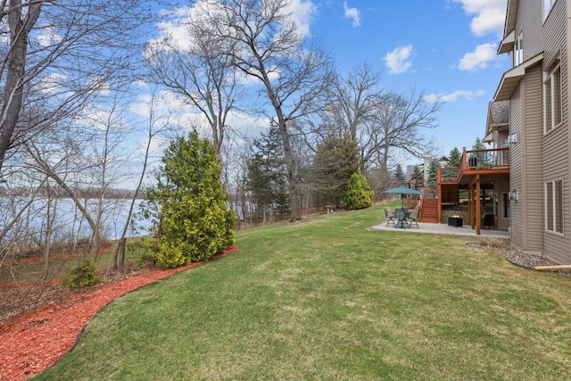 25124 Firefly Ave, Wyoming, MN 55092 - view of green lawn with a patio area and a deck with water view