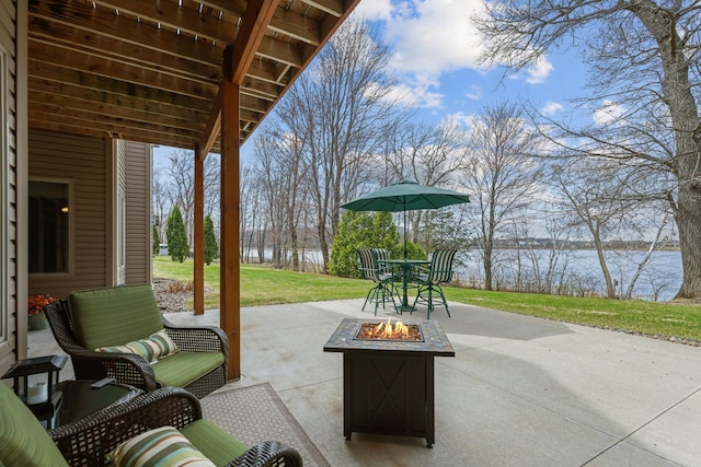 25124 Firefly Ave, Wyoming, MN 55092 - view of patio with an outdoor fire pit and a water view