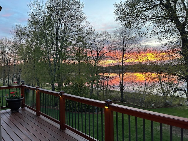 25124 Firefly Ave, Wyoming, MN 55092 - deck at dusk featuring a lawn