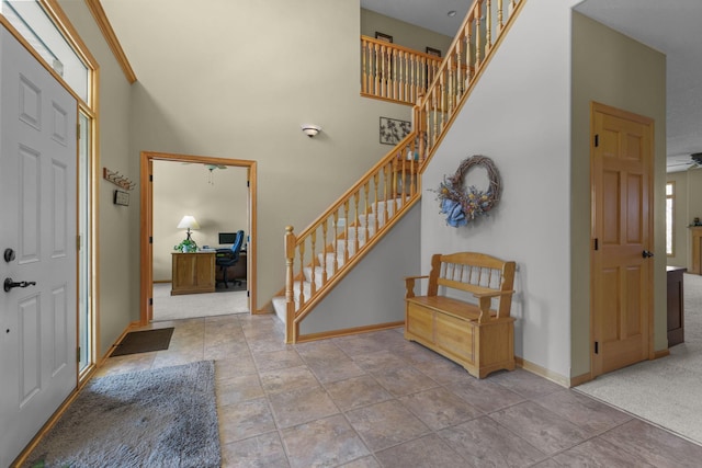 25124 Firefly Ave, Wyoming, MN 55092 - foyer entrance featuring stairway, a towering ceiling, and baseboards