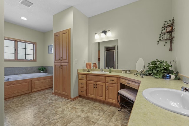 25124 Firefly Ave, Wyoming, MN 55092 - bathroom featuring double vanity, a garden tub, and a shower with door