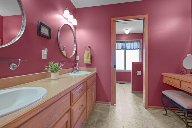 25124 Firefly Ave, Wyoming, MN 55092 - full bathroom featuring double vanity, baseboards, and tile patterned floors