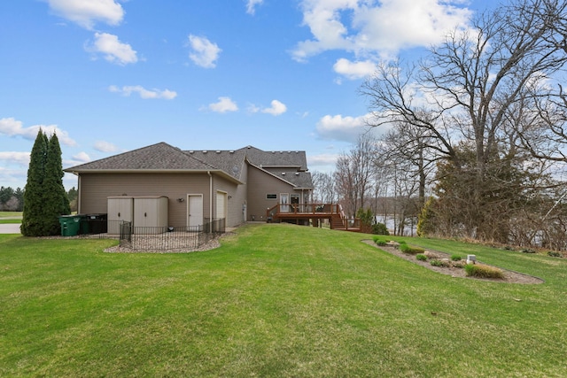 25124 Firefly Ave, Wyoming, MN 55092 - rear view of house featuring a wooden deck, a lawn, stairs, and roof with shingles