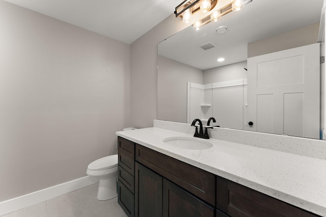 full bath with baseboards, toilet, vanity, and tile patterned floors