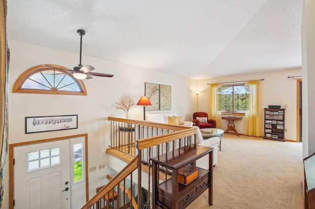 6637 Falstaff Rd, Woodbury, MN 55125 - entrance foyer featuring light colored carpet and a ceiling fan