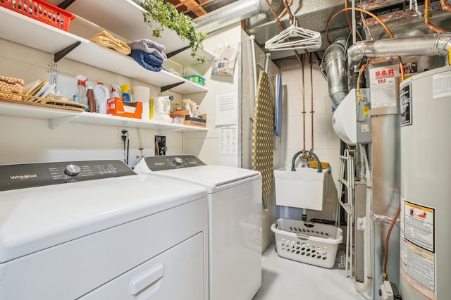 6637 Falstaff Rd, Woodbury, MN 55125 - laundry room with washer and clothes dryer, gas water heater, and a sink