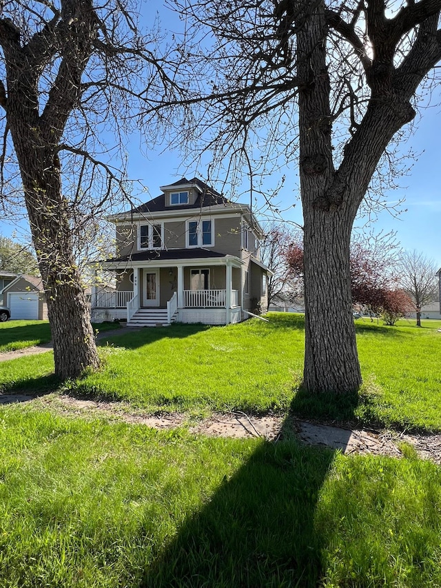 406 Pennsylvania Ave, Adrian, MN 56110 - traditional style home featuring covered porch and a front yard