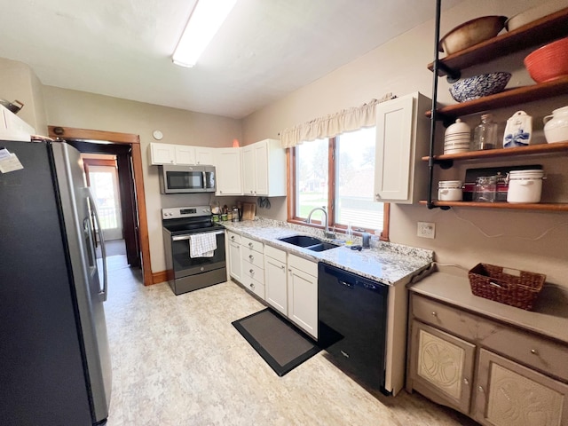 406 Pennsylvania Ave, Adrian, MN 56110 - kitchen featuring light floors, stainless steel appliances, white cabinets, and a sink