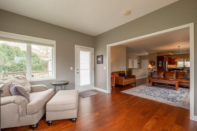 living room featuring baseboards and wood finished floors