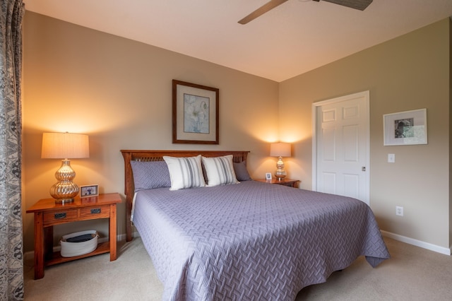 bedroom featuring carpet, baseboards, and a ceiling fan