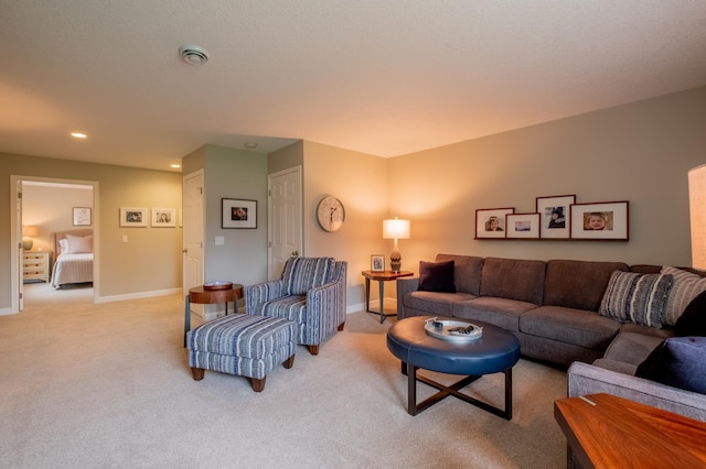 living room with baseboards, recessed lighting, and light colored carpet