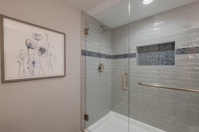 bathroom featuring a shower stall