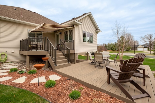 wooden deck featuring outdoor dining area