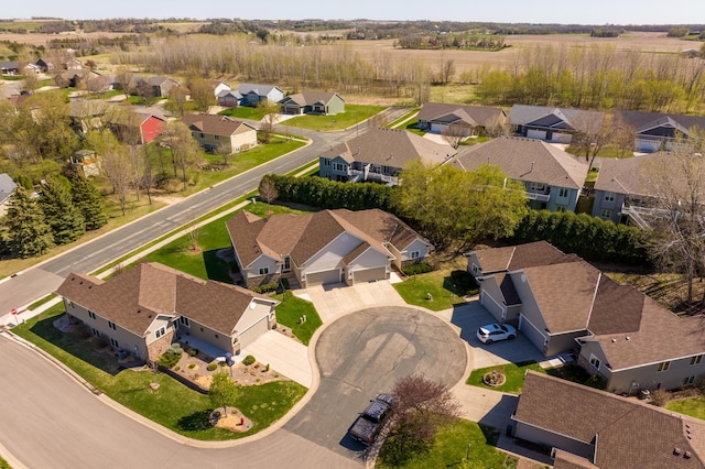 birds eye view of property with a residential view