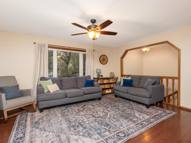 living area featuring a ceiling fan and wood finished floors