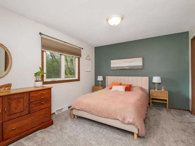 bedroom with carpet floors and visible vents