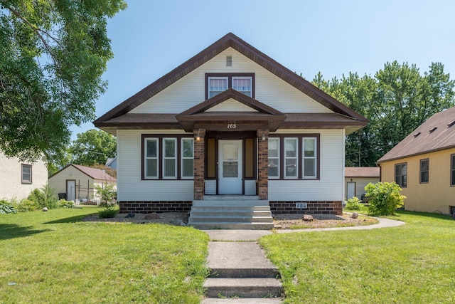 165 Park Ave, Le Center, MN 56057 - view of front of house with a front yard and crawl space