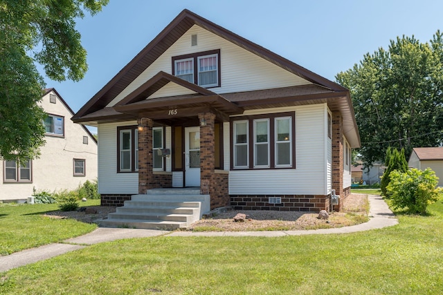 165 Park Ave, Le Center, MN 56057 - view of front of home with a porch, a front yard, and crawl space