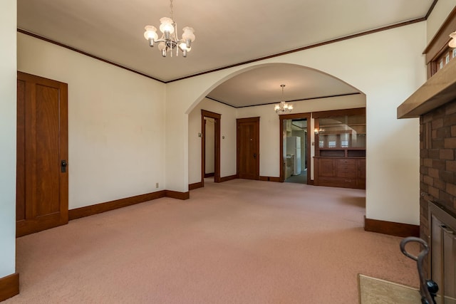 165 Park Ave, Le Center, MN 56057 - empty room with a chandelier, carpet flooring, arched walkways, and ornamental molding