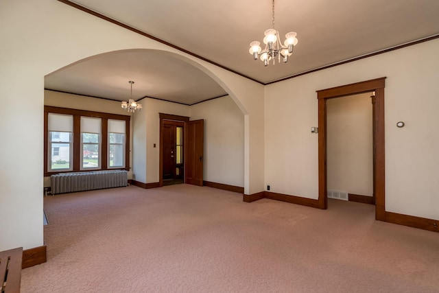 165 Park Ave, Le Center, MN 56057 - carpeted spare room featuring radiator, a chandelier, arched walkways, and ornamental molding