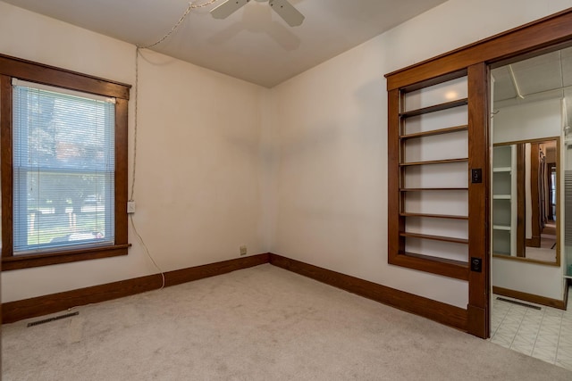 165 Park Ave, Le Center, MN 56057 - carpeted spare room with ceiling fan and baseboards