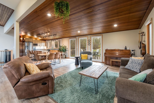 living area with recessed lighting, rail lighting, wood ceiling, and light wood-style floors