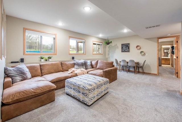 living room with baseboards, carpet, recessed lighting, and visible vents