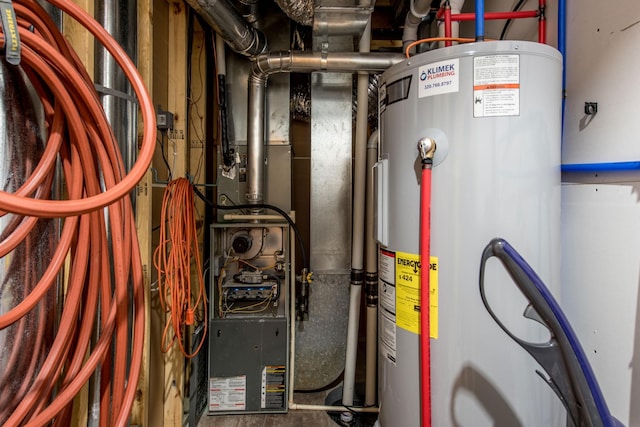 utility room featuring water heater