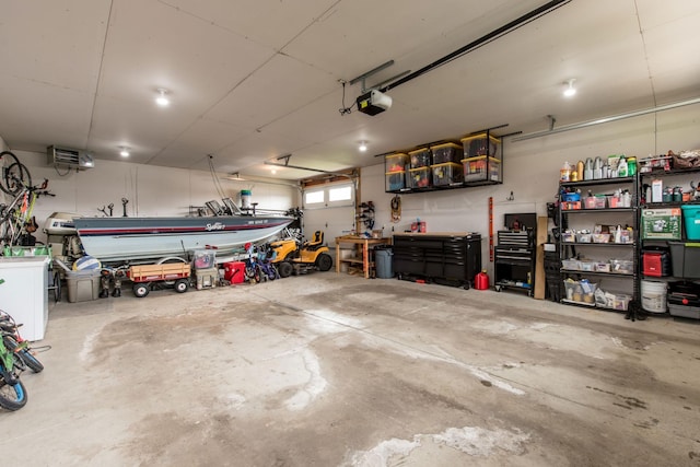 garage featuring a workshop area and a garage door opener