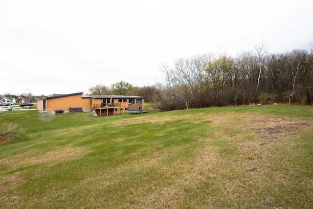 view of yard featuring a wooden deck