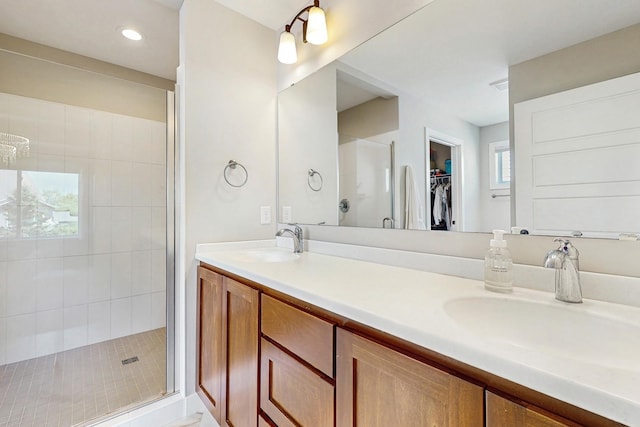 10725 Knollwood Ln, Woodbury, MN 55129 - full bath with a stall shower, double vanity, a spacious closet, and recessed lighting
