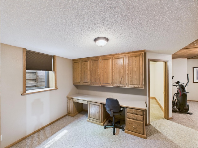 28656 195th Ave, Avon, MN 56310 - office area featuring light colored carpet, built in study area, a textured ceiling, and baseboards