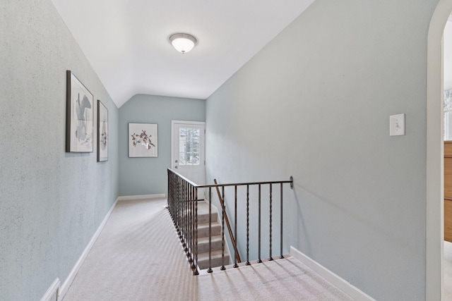 1870 Eleanor Ave, Saint Paul, MN 55116 - hall featuring an upstairs landing, vaulted ceiling, carpet floors, and arched walkways
