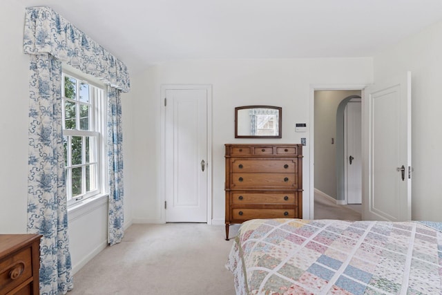 1870 Eleanor Ave, Saint Paul, MN 55116 - bedroom with light carpet, multiple windows, arched walkways, and lofted ceiling