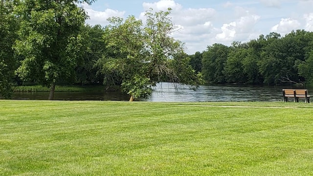 12018 71st St NE, Otsego, MN 55330 - exterior space featuring a water view, a yard, and a wooded view