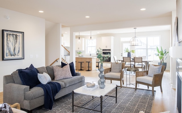10451 Blackmoor Rd, Woodbury, MN 55129 - living room featuring recessed lighting, dark wood-style flooring, and stairs