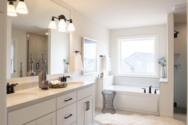 10451 Blackmoor Rd, Woodbury, MN 55129 - full bathroom with a garden tub, a sink, a stall shower, and double vanity