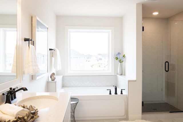 10451 Blackmoor Rd, Woodbury, MN 55129 - full bath featuring vanity, a stall shower, a garden tub, and a wealth of natural light