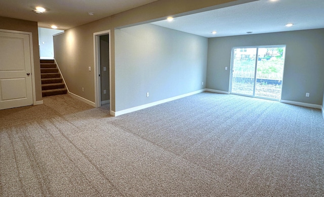 12301 71st Ct NE, Otsego, MN 55330 - carpeted empty room with stairs, baseboards, and recessed lighting