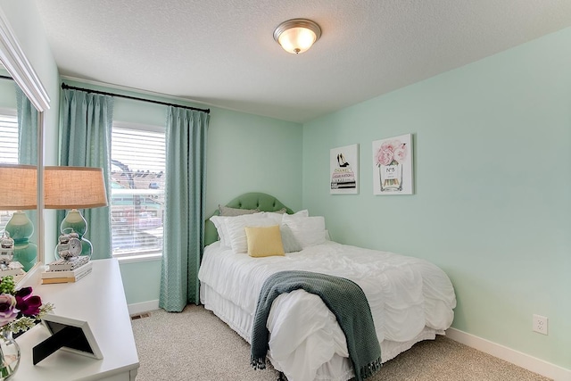 12301 71st Ct NE, Otsego, MN 55330 - bedroom featuring light colored carpet, baseboards, and a textured ceiling