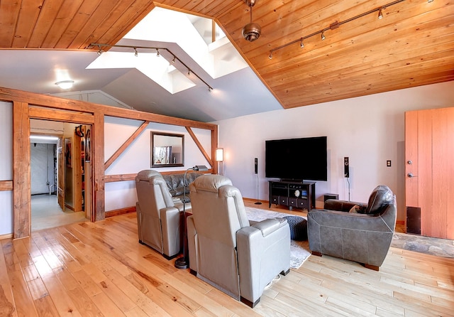 6575 145th St E, Cannon City Twp, MN 55057 - living room featuring rail lighting, wooden ceiling, light wood-style flooring, and vaulted ceiling with skylight