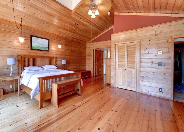 6575 145th St E, Cannon City Twp, MN 55057 - bedroom featuring lofted ceiling, wood walls, a closet, hardwood / wood-style flooring, and wooden ceiling