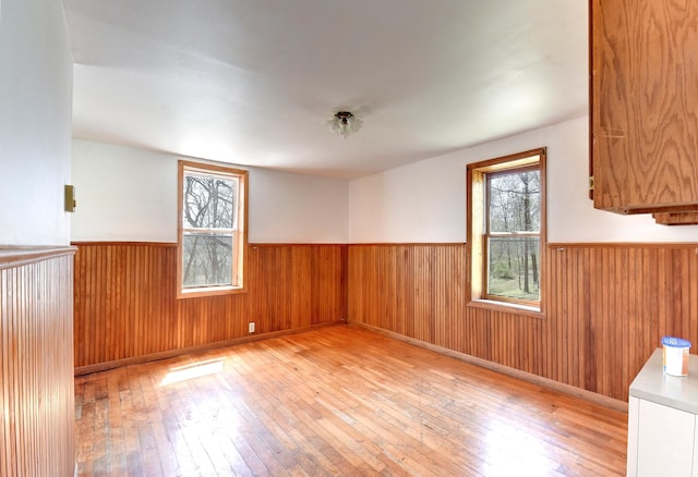 6575 145th St E, Cannon City Twp, MN 55057 - spare room featuring wainscoting and light wood-type flooring