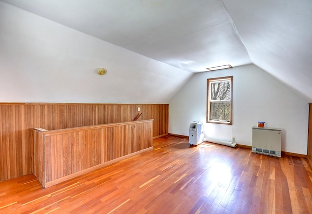 6575 145th St E, Cannon City Twp, MN 55057 - additional living space featuring lofted ceiling, baseboards, wooden walls, and wood finished floors