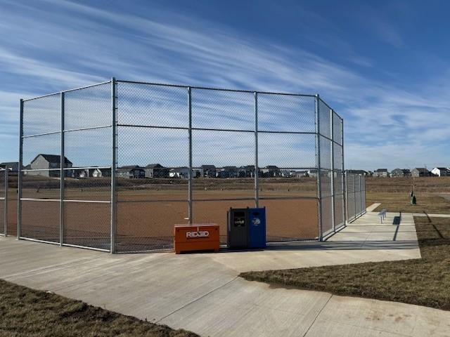 view of community with fence