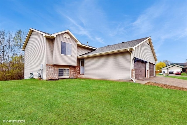 exterior space with brick siding, an attached garage, and a front lawn