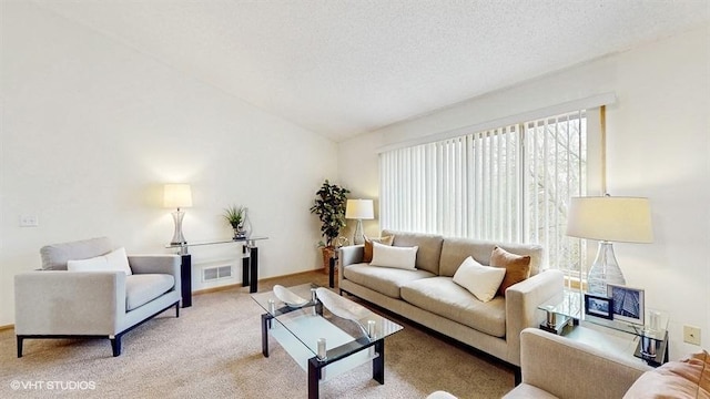living area with baseboards, light carpet, a textured ceiling, and visible vents