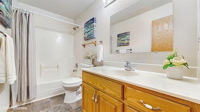 bathroom featuring toilet, a textured ceiling, shower / tub combo, and vanity