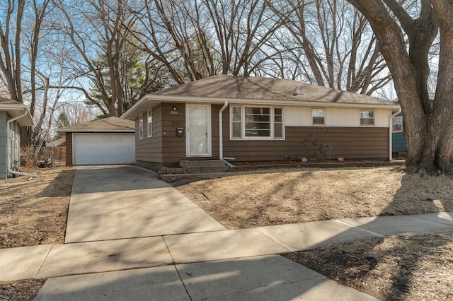 view of front of property featuring an outbuilding, entry steps, and a garage