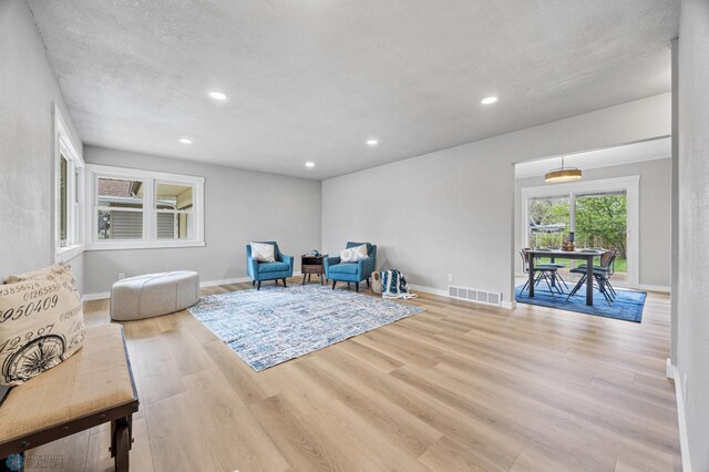 221 26th Ave N, Fargo, ND 58102 - living area featuring wood finished floors, recessed lighting, and baseboards
